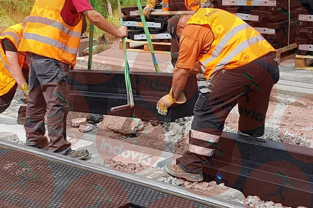 Baseplate crossing installation with rubber edge beams